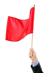 Hand waving a red flag